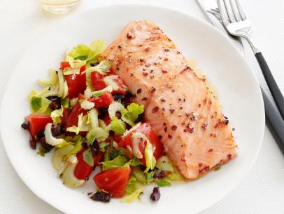 Salmon with warm olive-tomato salad